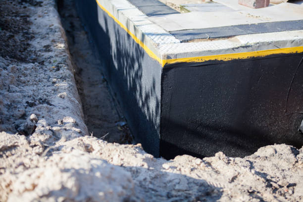 Professional Waterproofing technician working in Harbert, MI